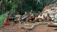 Luis Devin with Pygmy children in a rain forest camp