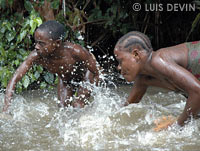 Baka Pygmy water drums in a rainforest river